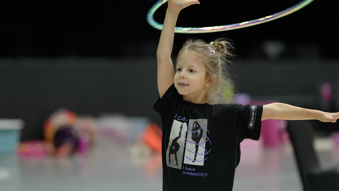 A girl working with a hoop during training